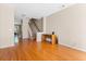 Spacious living room featuring hardwood floors, staircase, and a built-in desk area at 9226 Southern Oak Ln, Ladson, SC 29456