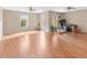 Open living room area with a hardwood floor, natural light, and ceiling fans at 9226 Southern Oak Ln, Ladson, SC 29456