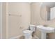 Neutral powder room features pedestal sink, toilet, and neutral paint at 9226 Southern Oak Ln, Ladson, SC 29456