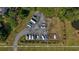 Aerial view of a boat storage area showcasing multiple boats, trees, and a waterway at 9428 Sweep Dr, Summerville, SC 29485