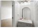 Well-lit bathroom featuring shiplap accent wall, gray vanity, and modern finishes at 9428 Sweep Dr, Summerville, SC 29485