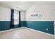 Charming bedroom featuring two-tone walls, a name decal, and bright natural light at 9428 Sweep Dr, Summerville, SC 29485