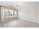 Cozy bedroom featuring vaulted ceilings, three windows, hardwood floors and a chandelier at 9428 Sweep Dr, Summerville, SC 29485