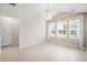 Bright bedroom featuring three windows, hardwood floors and a chandelier at 9428 Sweep Dr, Summerville, SC 29485