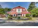 Exterior view of a clubhouse with beautiful landscaping and manicured gardens at 9428 Sweep Dr, Summerville, SC 29485