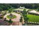 Stunning aerial view of the clubhouse with a water feature and manicured landscaping at 9428 Sweep Dr, Summerville, SC 29485