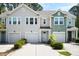 Charming townhomes featuring attached garages, manicured landscaping and craftsman-style details at 9428 Sweep Dr, Summerville, SC 29485