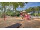 Community playground featuring multiple play structures, slides, and swings for Gathering fun at 9428 Sweep Dr, Summerville, SC 29485