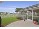 Enjoy a screened lanai, lush lawn, and picturesque pond views in this home's charming backyard at 1047 Tyron Cir, Charleston, SC 29414