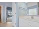 Well-lit bathroom features a white vanity, mirror, and doorway to another room at 1047 Tyron Cir, Charleston, SC 29414