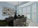 Formal dining area with large windows and stylish decor, virtually staged at 1047 Tyron Cir, Charleston, SC 29414