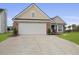 Charming brick home featuring a large two-car garage and well-manicured landscaping at 1047 Tyron Cir, Charleston, SC 29414
