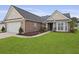 Lovely home with brick accents, a well-maintained lawn, and a welcoming entrance at 1047 Tyron Cir, Charleston, SC 29414