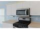 Kitchen with stainless steel microwave and gas range at 1047 Tyron Cir, Charleston, SC 29414