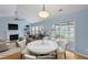 Staged living room with fireplace, built-in shelves, and sliding glass doors at 1047 Tyron Cir, Charleston, SC 29414