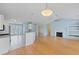 Open concept living room featuring hardwood floors and a fireplace at 1047 Tyron Cir, Charleston, SC 29414