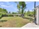 Expansive backyard featuring green grass, mature trees, and a well-maintained lawn at 105 Dalton Ave, North Charleston, SC 29420