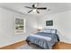 Bedroom features a ceiling fan, hardwood floors and a large window at 105 Dalton Ave, North Charleston, SC 29420