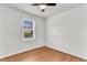 Bright and airy bedroom with hardwood floors and a large window at 105 Dalton Ave, North Charleston, SC 29420