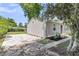 Angle view of a gray house and a driveway, along with a landscaped garden and surrounding greenery at 105 Dalton Ave, North Charleston, SC 29420