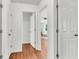 Bright hallway showcasing natural wood floors, and multiple entryways at 105 Dalton Ave, North Charleston, SC 29420