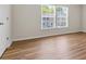 Bright bedroom with wood-look floors and natural light at 1086 Lexi Ct, Ladson, SC 29456