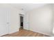 Bedroom with hardwood floors and view into the bathroom at 1086 Lexi Ct, Ladson, SC 29456