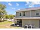 Exterior backyard view with screened-in porch and lawn at 1086 Lexi Ct, Ladson, SC 29456