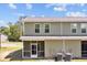 Back exterior view of home featuring a screened-in porch and well-maintained lawn at 1086 Lexi Ct, Ladson, SC 29456