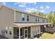 Rear exterior view showcasing covered porch, siding, and well-manicured landscape at 1086 Lexi Ct, Ladson, SC 29456
