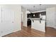 Open kitchen with dark wood cabinets, stainless steel appliances, and a breakfast bar at 1086 Lexi Ct, Ladson, SC 29456