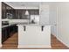 Modern kitchen featuring granite countertops, stainless steel appliances, and dark wood cabinetry at 1086 Lexi Ct, Ladson, SC 29456