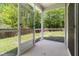 Screened-in porch offering an outdoor living space overlooking the backyard at 1086 Lexi Ct, Ladson, SC 29456