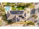 Aerial view of home showcasing a large roof with solar panels and backyard pool at 109 Carolina Blvd, Isle of Palms, SC 29451