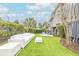 Backyard with outdoor furniture, seating and manicured landscaping at 109 Carolina Blvd, Isle of Palms, SC 29451