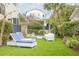 Lush backyard with manicured lawn, comfortable seating, and a view of the refreshing pool at 109 Carolina Blvd, Isle of Palms, SC 29451