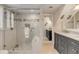 Elegant bathroom featuring a glass enclosed shower and marble vanity with double sinks at 109 Carolina Blvd, Isle of Palms, SC 29451