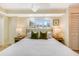 Comfortable bedroom with a ceiling fan and a window view of the outdoors at 109 Carolina Blvd, Isle of Palms, SC 29451