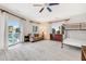 Well-lit bedroom with sliding doors to a balcony, bunkbeds and a tan couch at 109 Carolina Blvd, Isle of Palms, SC 29451
