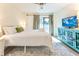 Cozy bedroom with a patterned rug, blue accent cabinet, and a flat screen tv at 109 Carolina Blvd, Isle of Palms, SC 29451