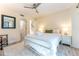 Comfortable bedroom featuring a metal bed frame, patterned rug, and adjacent stairway at 109 Carolina Blvd, Isle of Palms, SC 29451