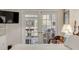 Bright bedroom with French doors to an outdoor space and a wall-mounted television at 109 Carolina Blvd, Isle of Palms, SC 29451
