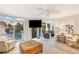 Cozy living room with a modern ceiling fan, comfortable seating, and access to the balcony at 109 Carolina Blvd, Isle of Palms, SC 29451