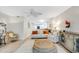 Open-concept living space with a neutral color palette, comfortable seating, and a view into the kitchen at 109 Carolina Blvd, Isle of Palms, SC 29451