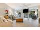 Bright living room with shiplap wall, comfortable seating, and view of the outdoor scenery at 109 Carolina Blvd, Isle of Palms, SC 29451
