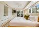 Beautiful main bedroom with storage, a ceiling fan, and French doors leading to a private balcony at 109 Carolina Blvd, Isle of Palms, SC 29451