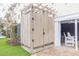 Private outdoor shower area with wood enclosure and a charming pergola at 109 Carolina Blvd, Isle of Palms, SC 29451