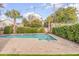 Refreshing backyard pool surrounded by brick pavers, mature trees and landscaping at 109 Carolina Blvd, Isle of Palms, SC 29451