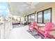 Spacious porch featuring outdoor furniture, ceiling fans, string lights, and backyard views at 109 Carolina Blvd, Isle of Palms, SC 29451
