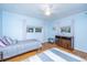 Bedroom featuring two beds, wood floors, ceiling fan and soft natural light at 112 Furlong Rd, Summerville, SC 29483
